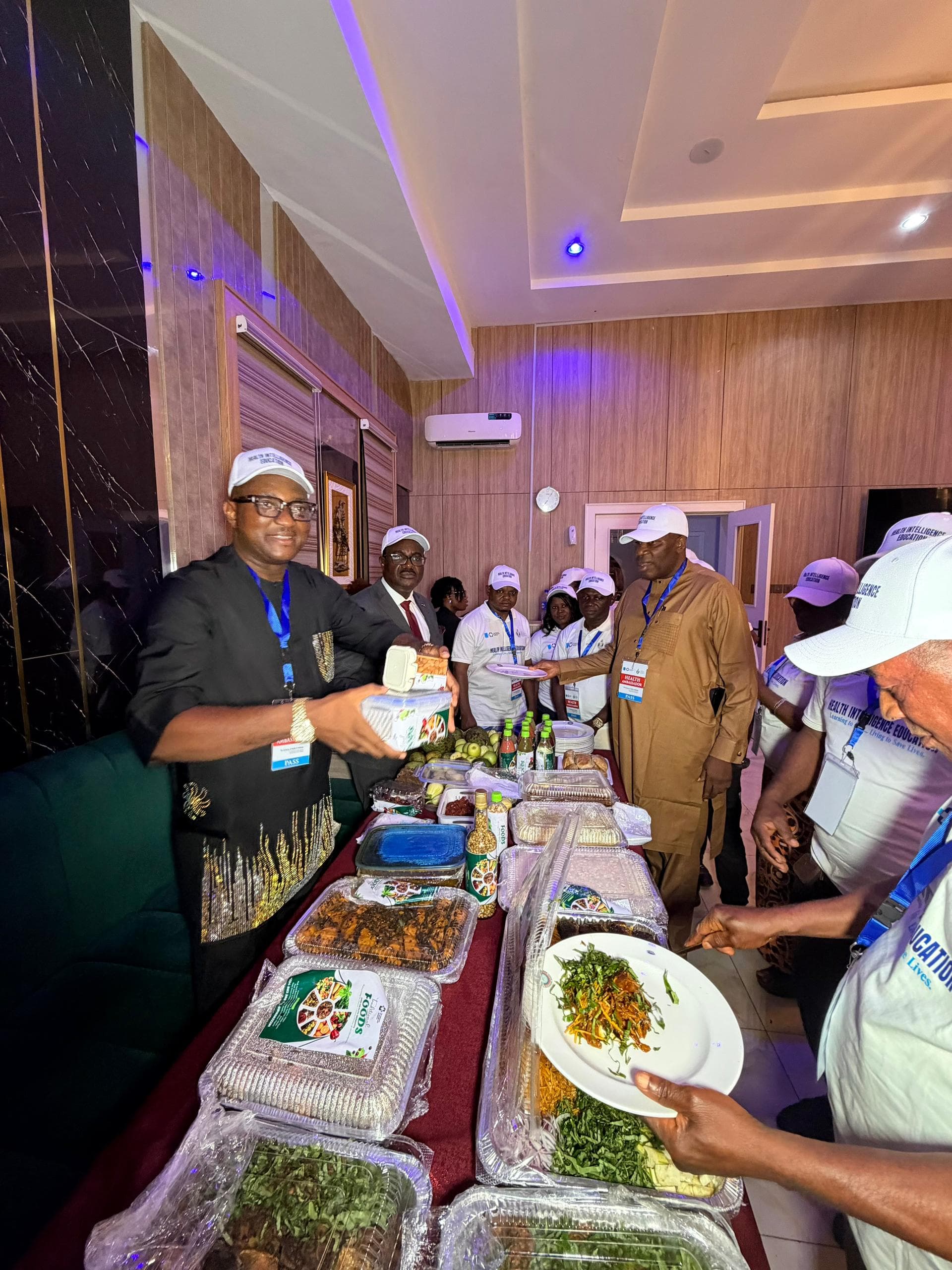 Health Ambassadors in Health Intelligence Education branded caps and shirts at the programme's reception event
